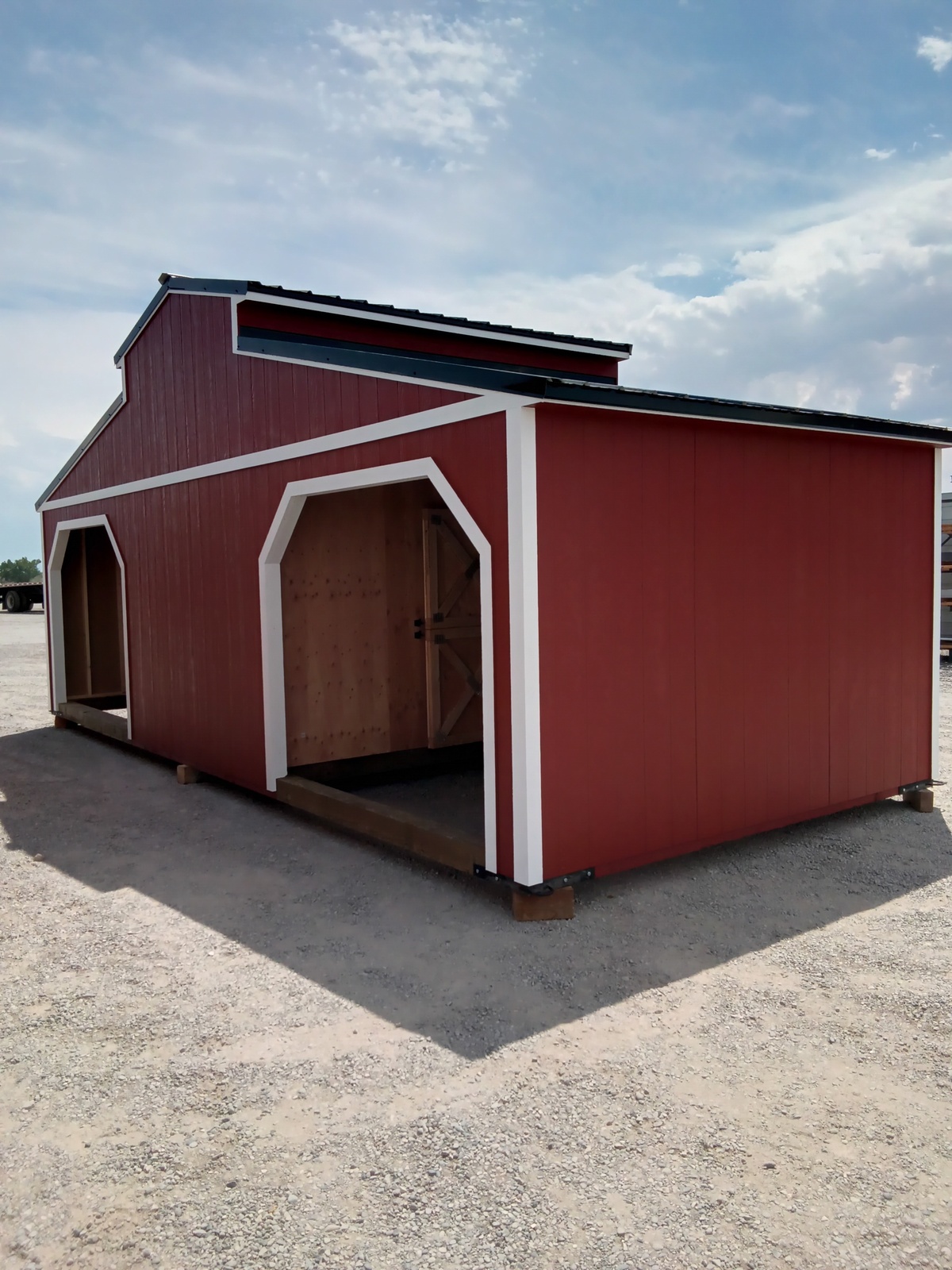 A red Westerner - 2908 shed with its door open.